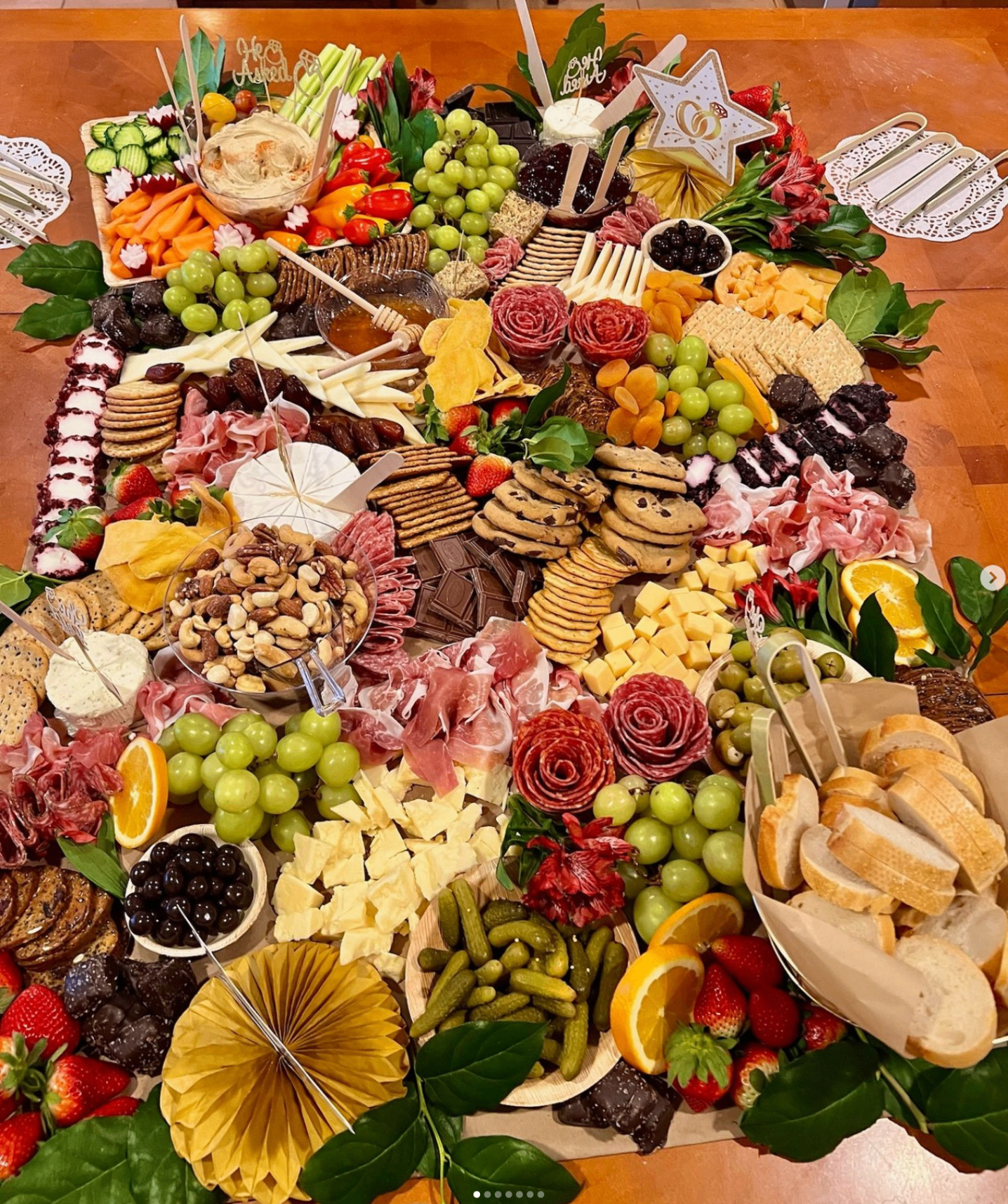 Overhead view of a lush grazing table for an engagement celebration